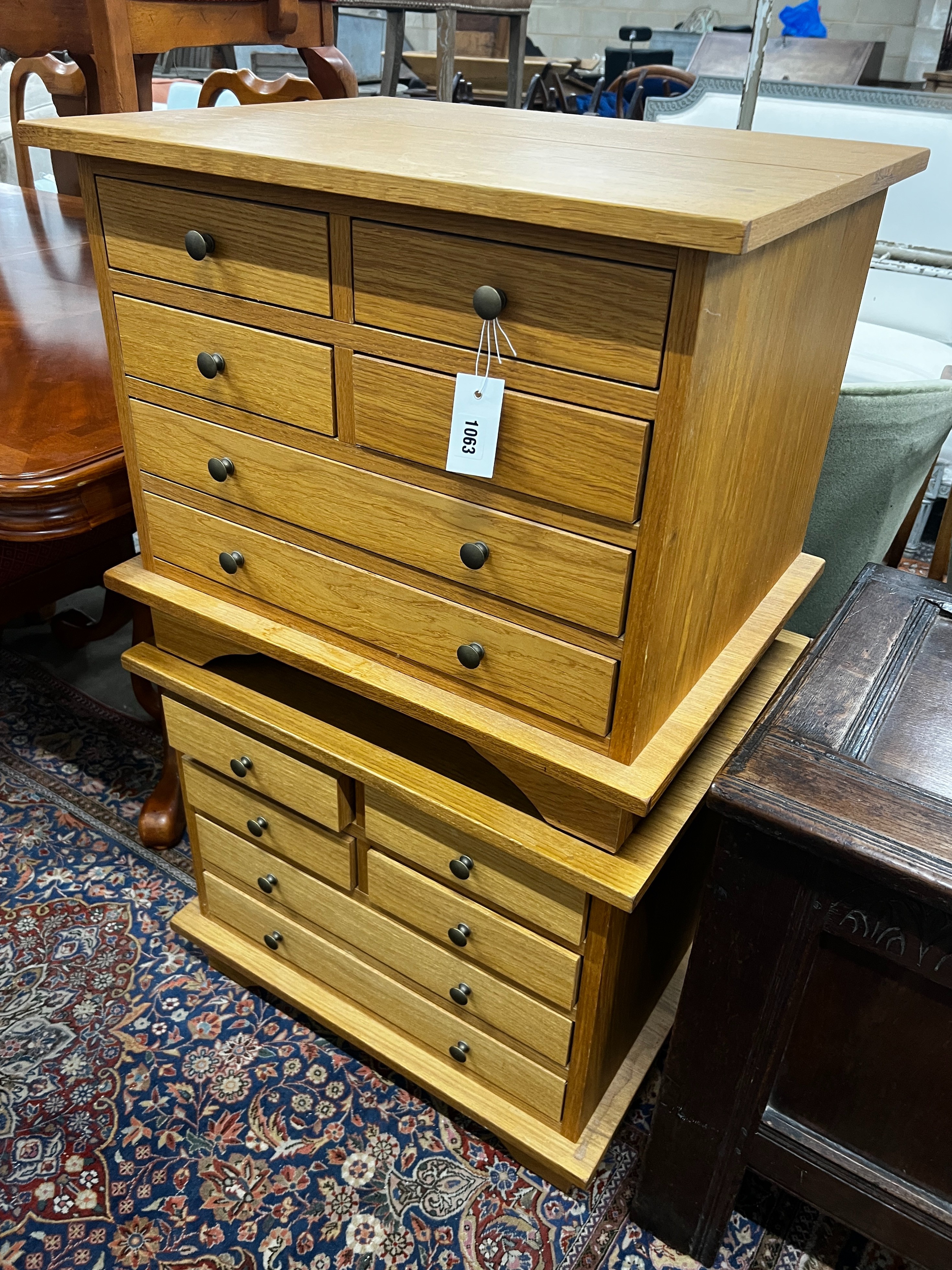 A pair of contemporary Laura Ashley Garrat oak six drawer bedside chests, width 63cm, depth 50cm, height 53cm